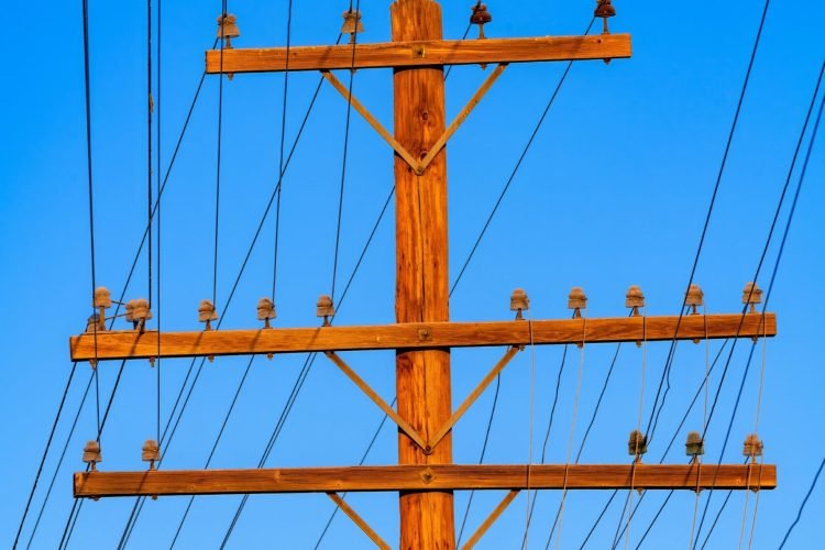 Old,Wooden,Telephone,Pole,With,Electrical,Lines